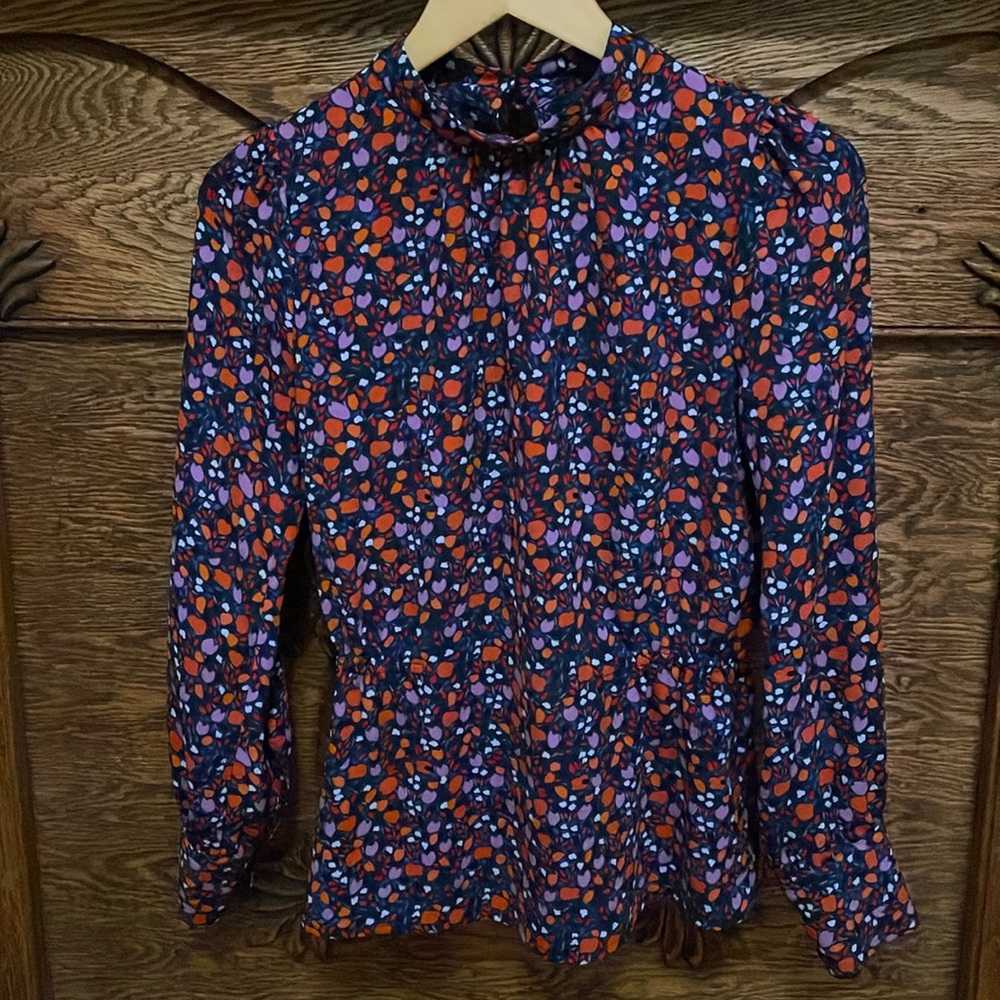 Orange, purple, navy peplum top